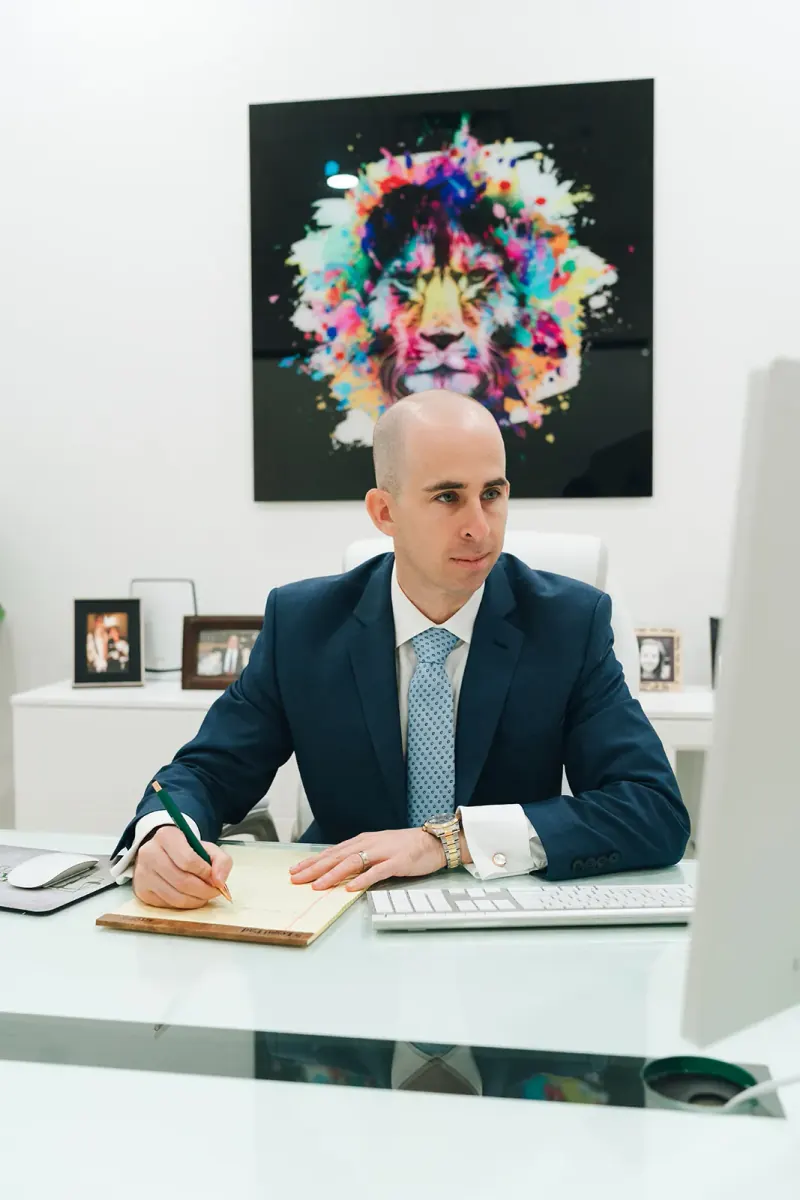 Seth Green at his desk in the Boynton Beach office